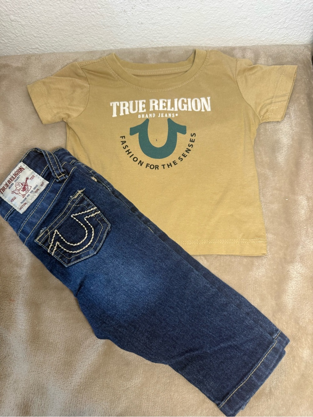 True Religion Toddler Tan Logo Tee with Dark Blue Jeans